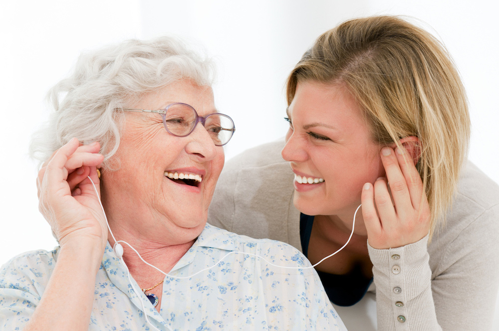 Woman with Senior Listening to Music