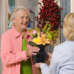 Flowers and a senior woman