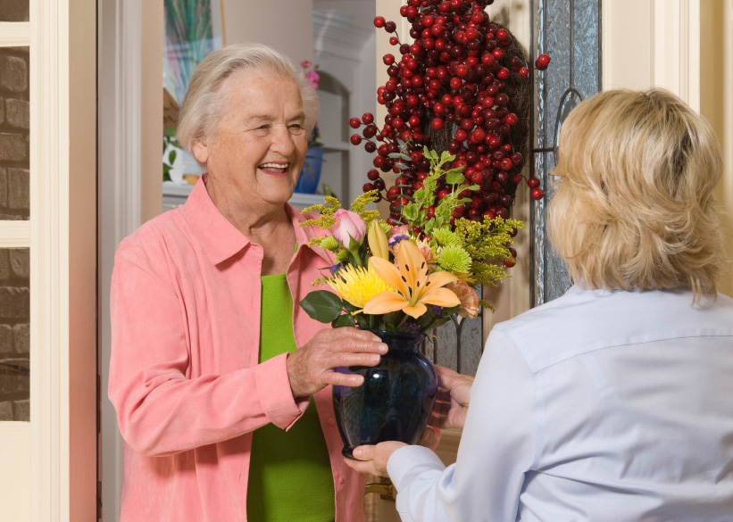 Flowers and a senior woman